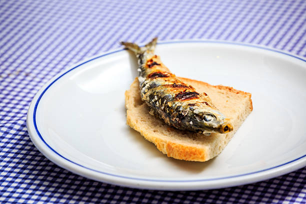 istock Grilled sardine on slice of bread 614234088