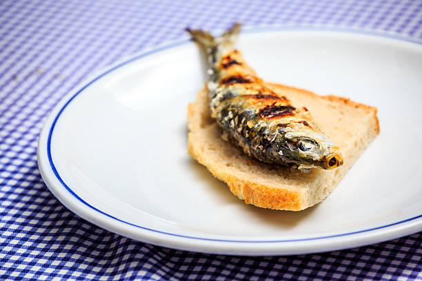 istock Grilled sardine on slice of bread 614234170