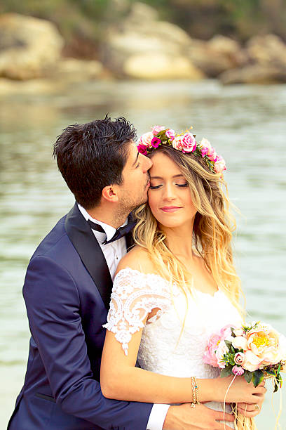 istock Wedding Kiss at beach. 614235374