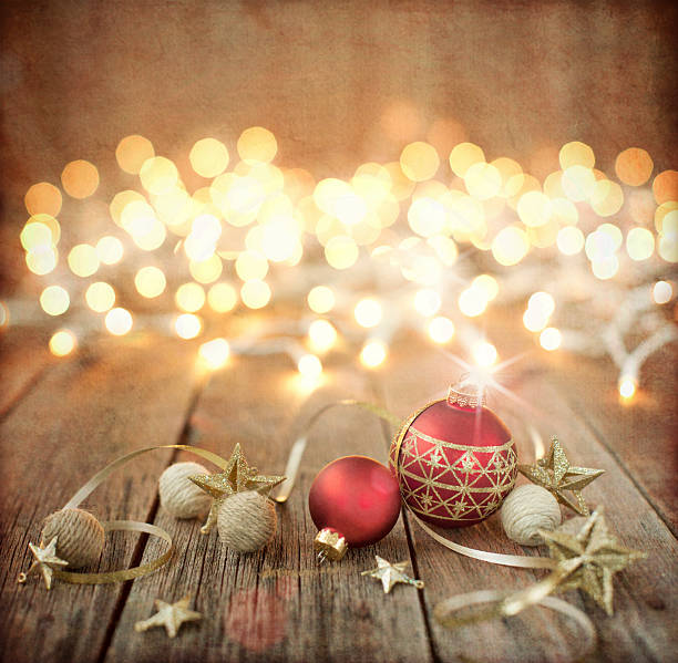 istock Christmas Ornament Baubles, on Old Wood Background with Defocused Lights 614236476