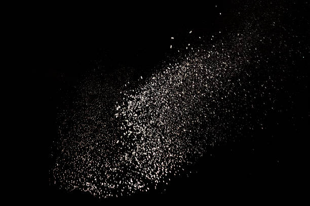 white dust debris isolated on black background - mahvolmuş stok fotoğraflar ve resimler