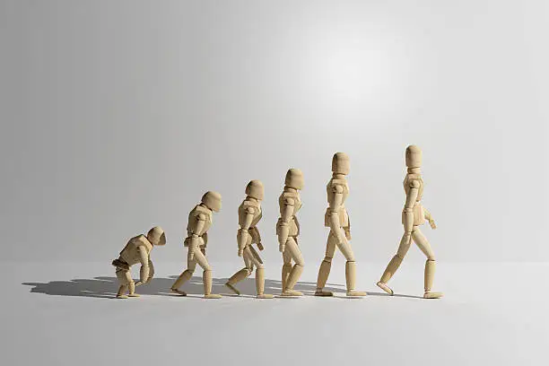 3d rendering of wooden mannequin toys prototype of human evolution. Copyspace.