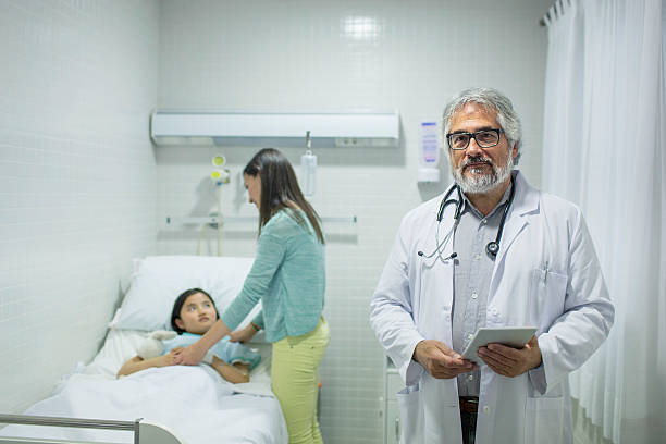 istock Mother, Child and Doctor 614240104