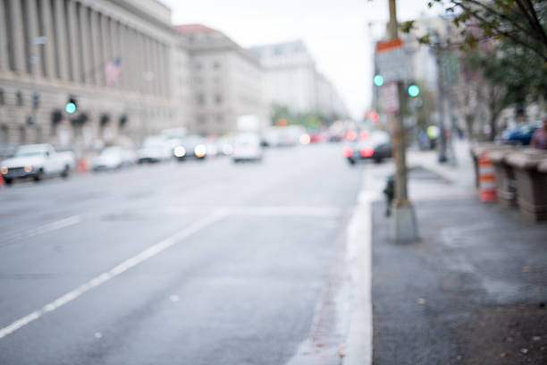 istock Blurred city street with traffic 614240182