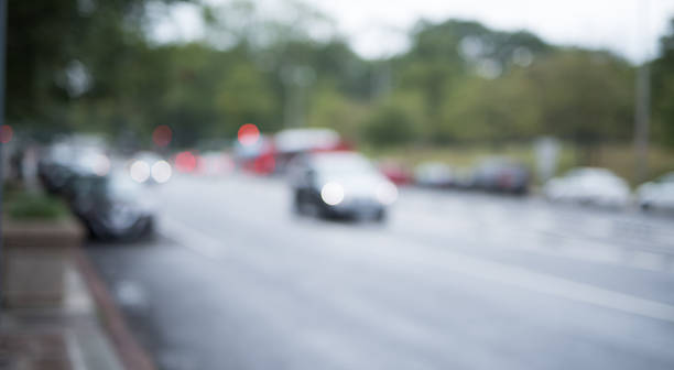 istock Blurred city street with traffic 614240300