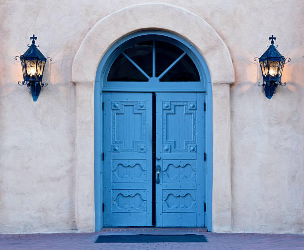 istock Dawn on blue doors of Albuquerque church 614240550