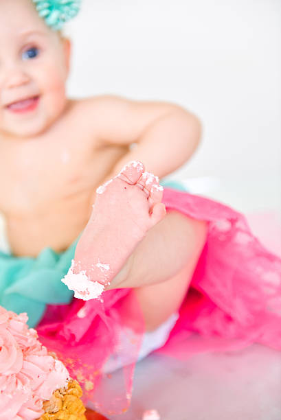 istock first birthday Portraits with smash cake 614243500