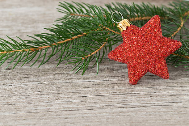 istock Red christmas star on a wooden background 614244688