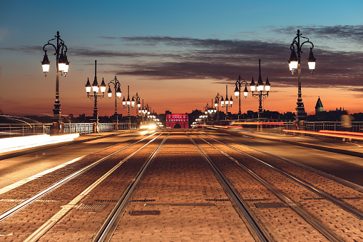 Pont de Pierre and tramway rail on the bridge sunset, Bordeaux, France