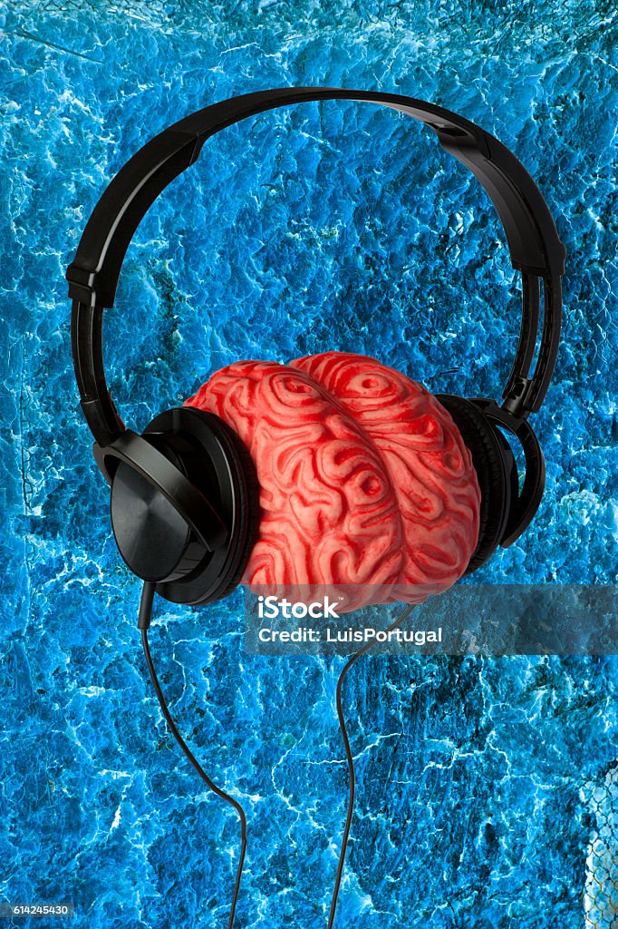 Headphones, Brain and a Blue Background Listening Stock Photo