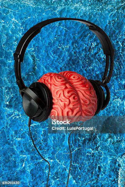 Headphones Brain And A Blue Background Stock Photo - Download Image Now - Listening, Music, Abstract