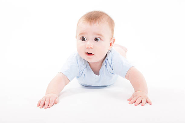 istock baby in the body lying  on a white background 614246040