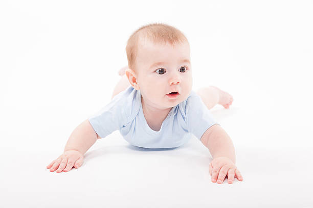 istock baby in the body lying  on a white background 614246084