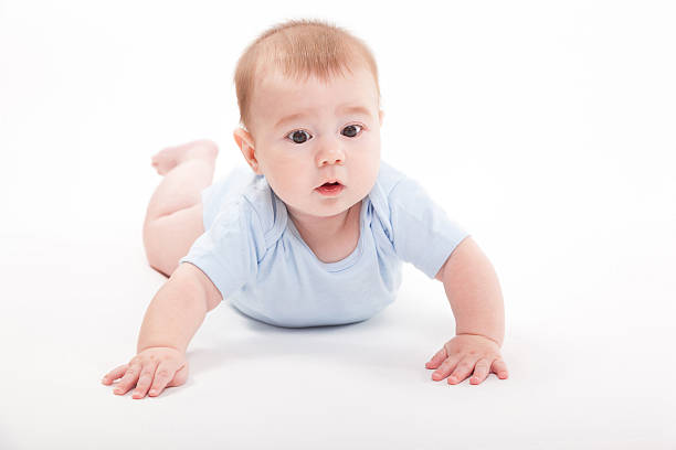istock baby in the body lying  on a white background 614246238