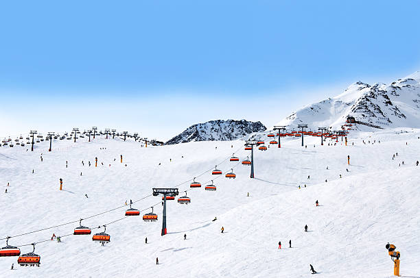 Skiers and chairlifts in Solden, Austri stock photo