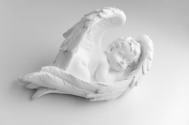 istock Little Sleeping Angel on white background, black and 614247496