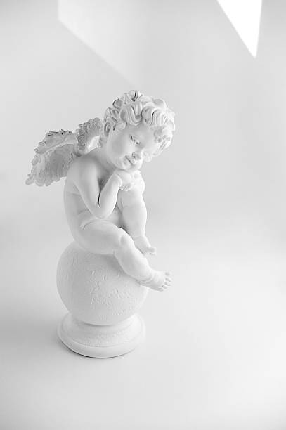 istock Little Sleeping Angel on white background, black and 614247556