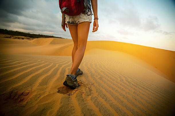 istock Hiker walking in the desert 614248332
