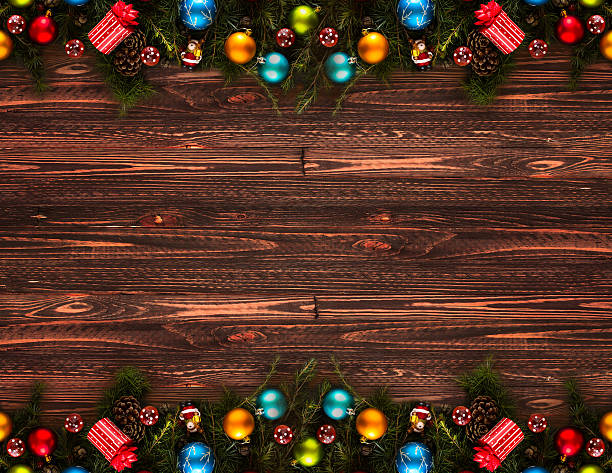 istock Merry Christmas Frame with real wood and colorful baubles 614248640