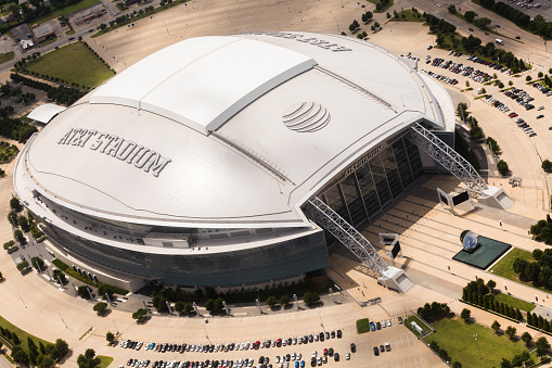 Arlington, TX, United States - May 17, 2016: Aerial view of AT&T Stadium and surrounding area. AT&T logo is seen on top of the stadium with retractable roof. AT&T Stadium is home to the NFL Dallas Cowboys football team.