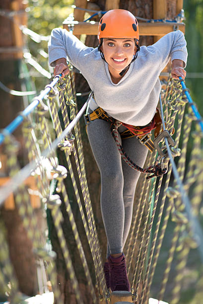 istock Brave confident woman walking on a narrow path 614250554