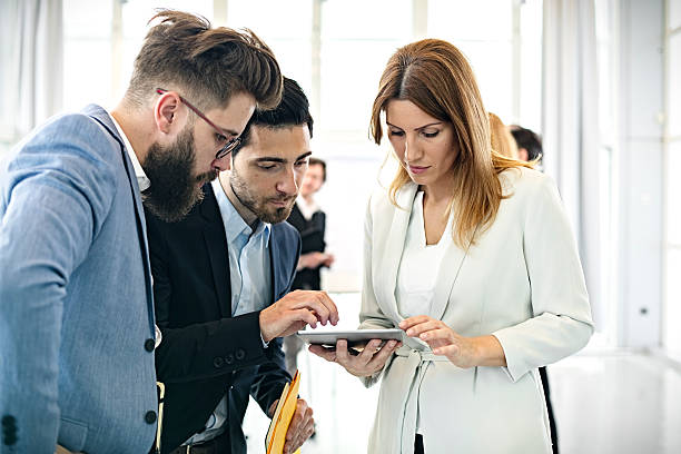 istock Business woman  discussing project with colleagues in office 614251076