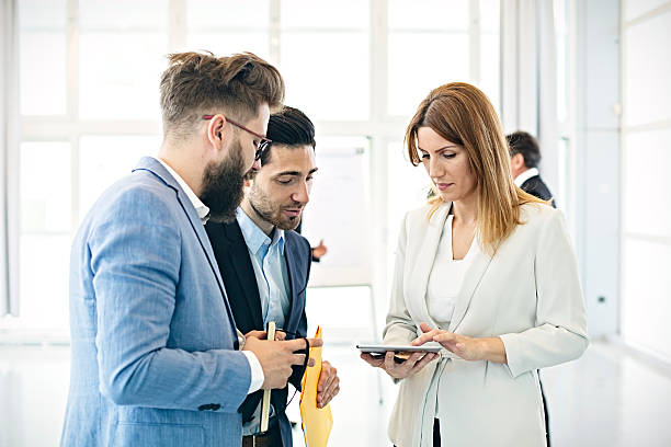 istock Business woman  discussing project with colleagues in office 614251128