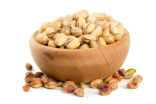 istock bowl of pistachio isolated on white 614251972