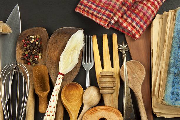 istock Kitchen utensils on wooden table. Tools cook. Needs to cook. 614303186