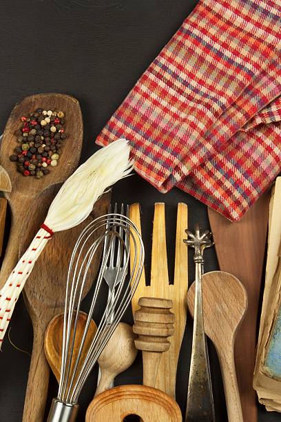 istock Kitchen utensils on wooden table. Tools cook. Needs to cook. 614303302