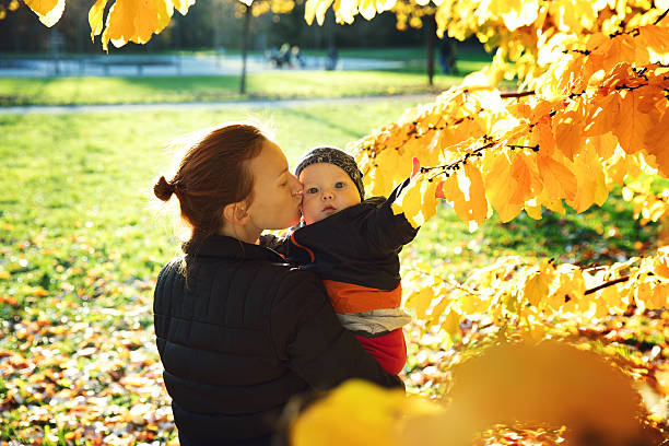 istock Family in the autumn park. 614303600