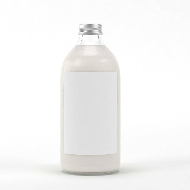 istock Glass bottle with liquid on white background. 614304134
