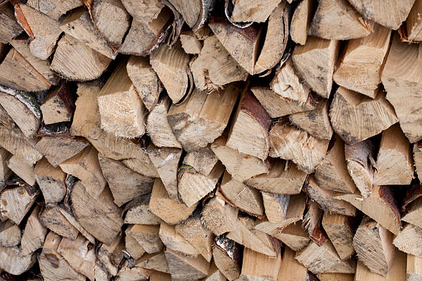 Stacked chopped firewood as background stock photo