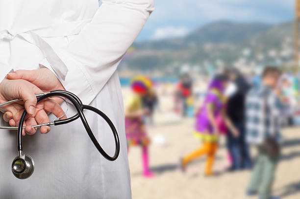 istock The doctor put his hands with stethoscope behind his back 614309748