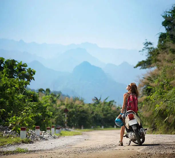 Photo of Young lady with bike