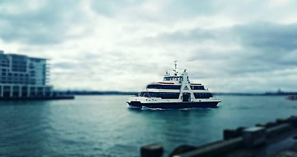 istock Boat Sailing into Auckland 614310880