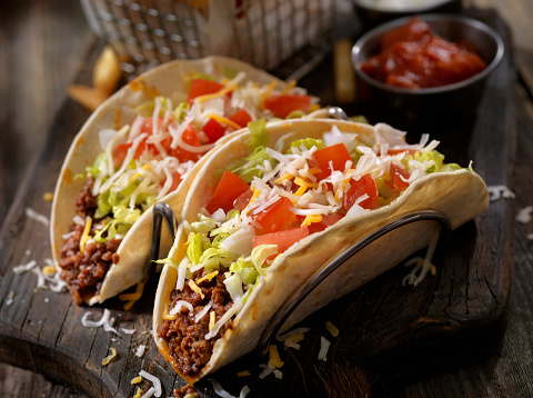 Soft Tacos With Ground Beef, Lettuce, Tomato, Onions and Cheese - Photographed on Hasselblad H3D2-39mb Camera
