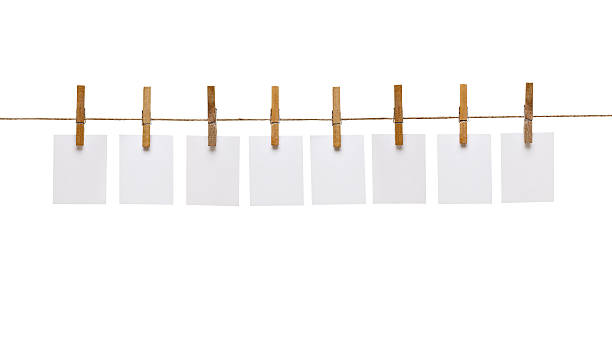 istock clothes peg and note paper on clothes line rope 614314280