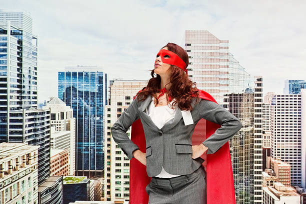 istock Female superhero looking up outdoors 614315310