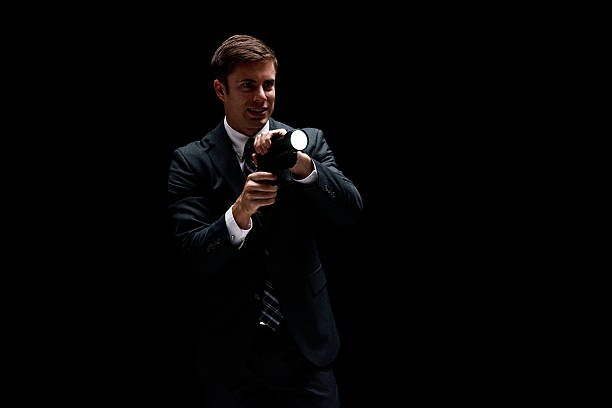 istock Smiling businessman in action with flash light 614315412