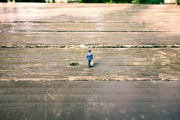 istock Businessman walking on the wooden table 614319144