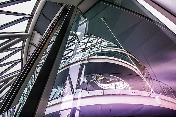 Futuristic Architecture of London City Hall Spiral staircase at the government building of London City Hall. Picture taken from outside through the glass.  City Hall is home to the Mayor of London, the London Assembly and the 600 or so permanent staff who work for the GLA. gla building stock pictures, royalty-free photos & images