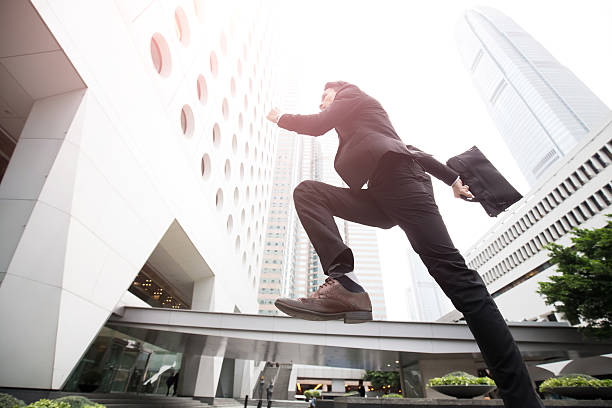 istock businessman is running in honkong 614319676