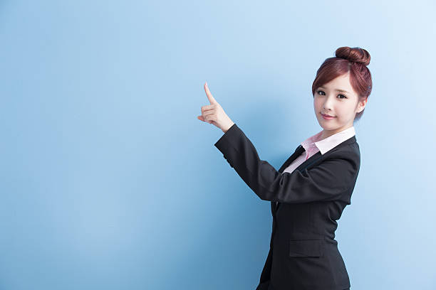 istock business woman show something 614320222