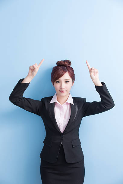 istock business woman show something 614320240