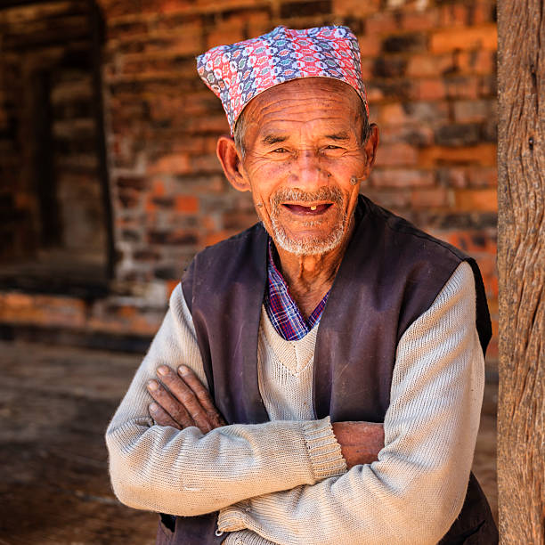 istock Old Nepali man resting in Bhaktapur 614320356