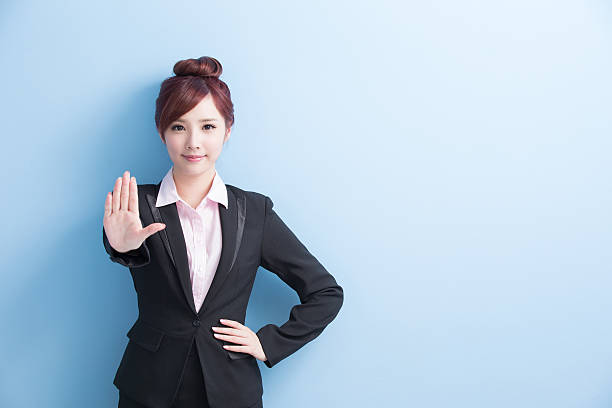 istock business woman do stop gesture 614320408