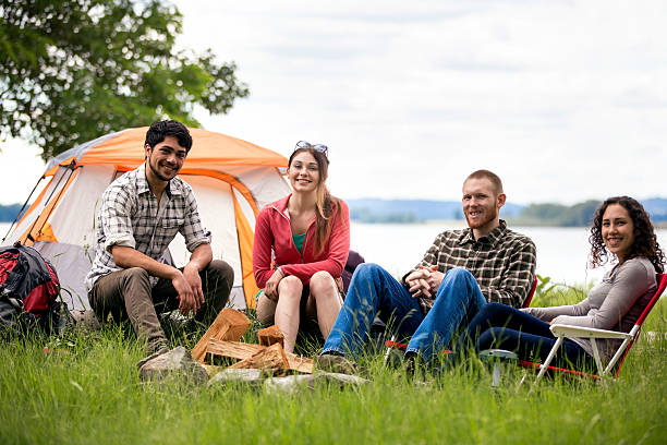 istock Diverse group of friends sitting around a campfire 614320662