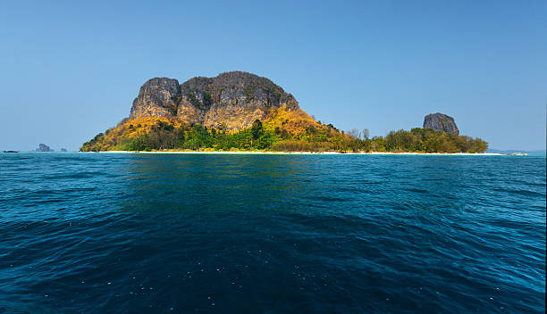 istock Tropical island and blue sea 614321196