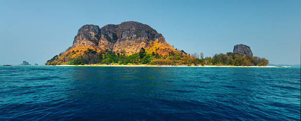 istock Tropical island and blue sea 614322142
